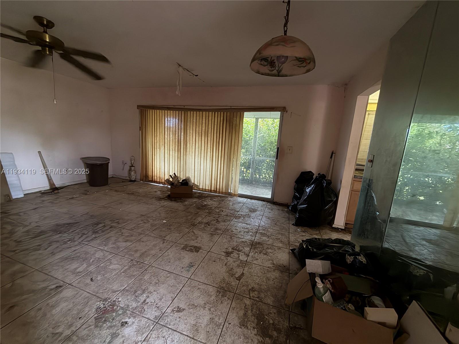 17247 Southwest 112th Place, Unit 21044 Miami, FL 33157 - Photo 2 of 9 a room with furniture and a window