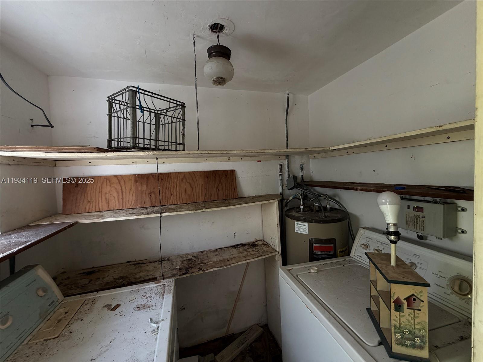 17247 Southwest 112th Place, Unit 21044 Miami, FL 33157 - Photo 8 of 9 a kitchen with a stove and a refrigerator