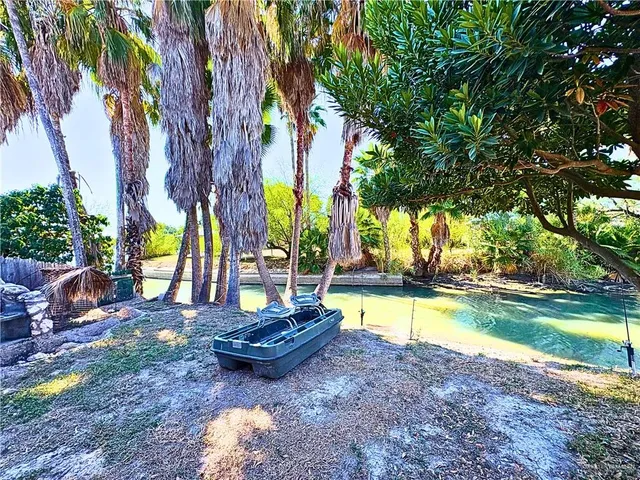 a view of a roof deck with table and chairs a floor to ceiling window with wooden fence