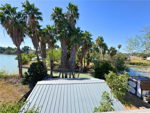 a view of swimming pool with outdoor seating and deck