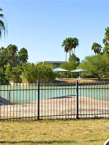 a view of a wooden door and a yard