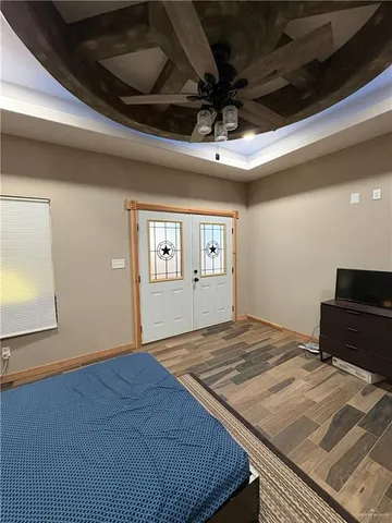 a living room with a bed and a fireplace