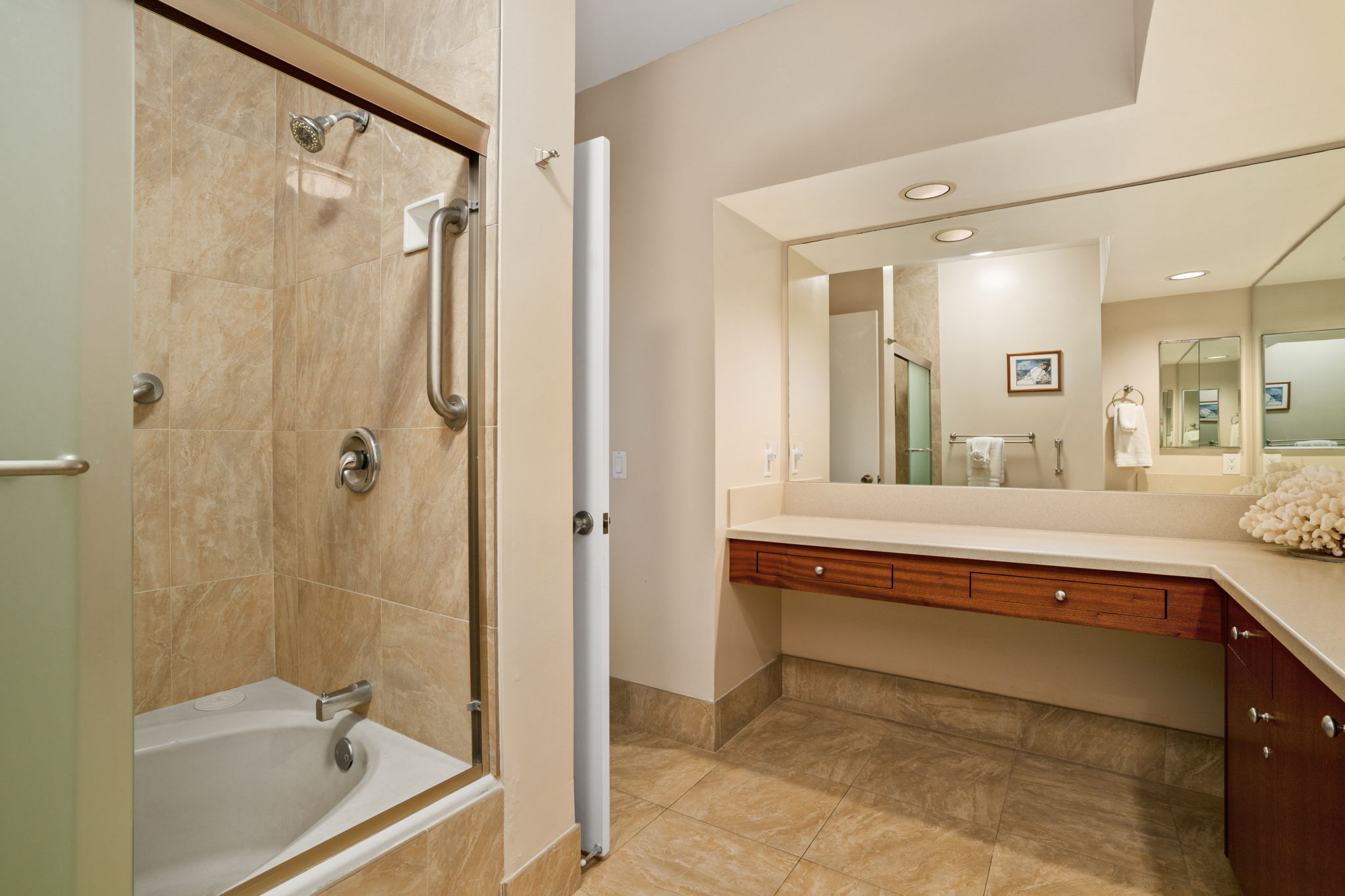 1568 Pe'e Road, Unit 211 Koloa, HI 96756 - Photo 15 of 30 a bathroom with a tub a sink and a mirror