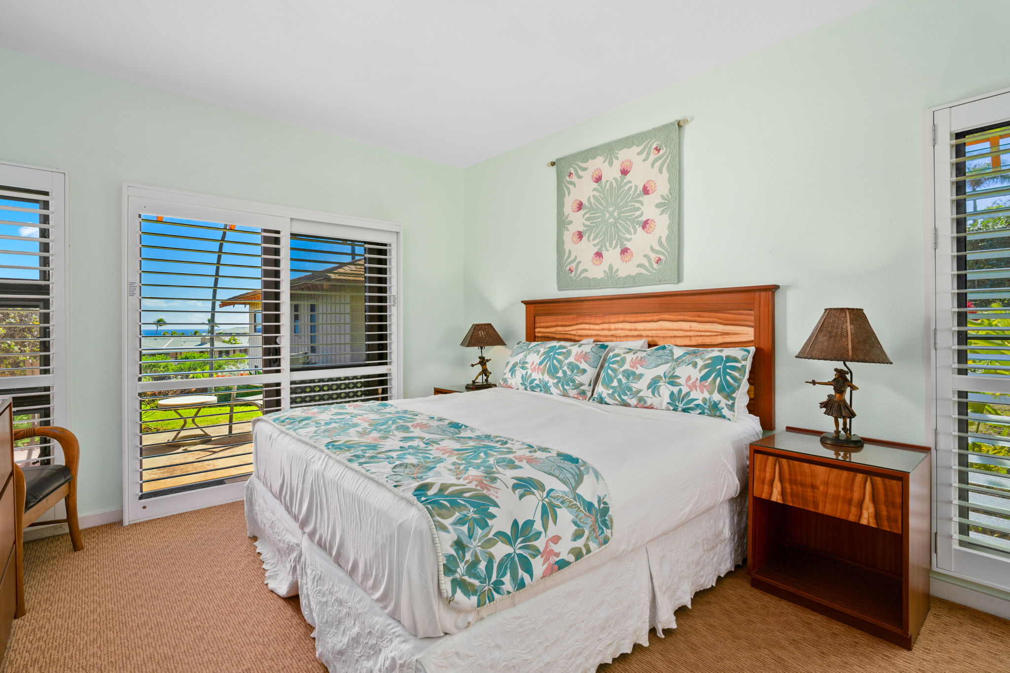 1568 Pe'e Road, Unit 211 Koloa, HI 96756 - Photo 17 of 30 a bed sitting in a bedroom next to a window