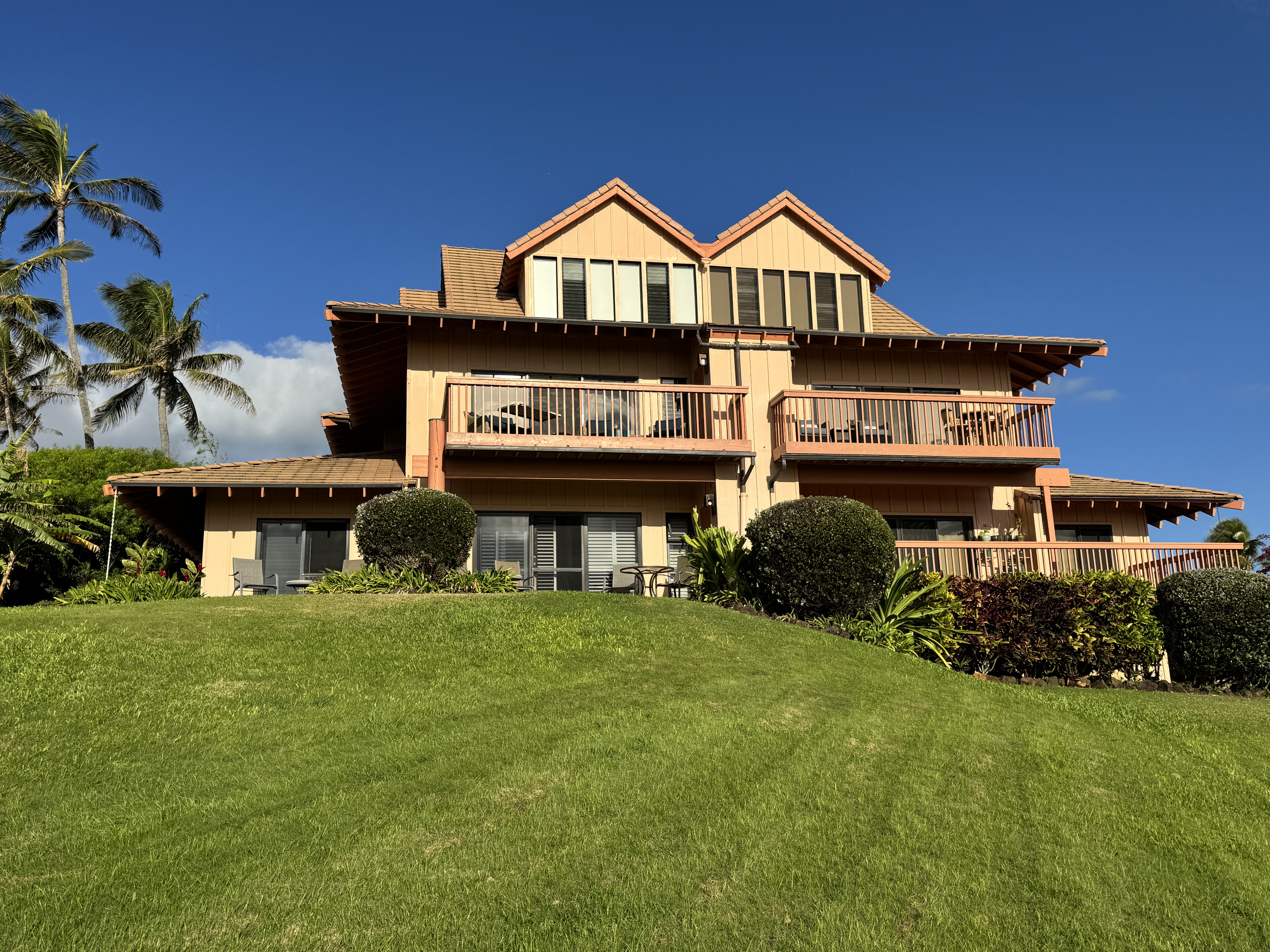 1568 Pe'e Road, Unit 211 Koloa, HI 96756 - Photo 25 of 30 a front view of a house with garden