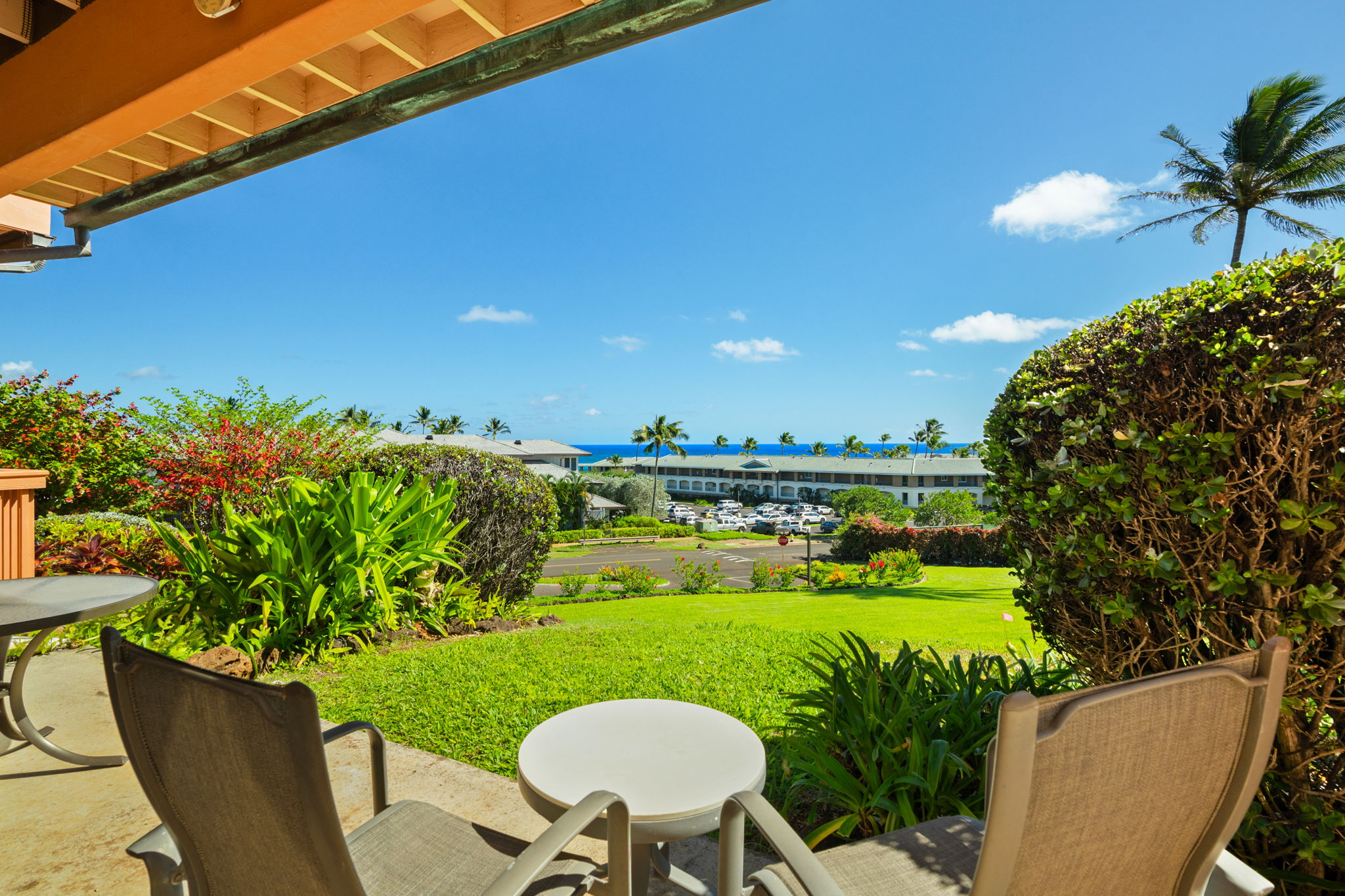 1568 Pe'e Road, Unit 211 Koloa, HI 96756 - Photo 27 of 30 a view of a chairs and table in the patio