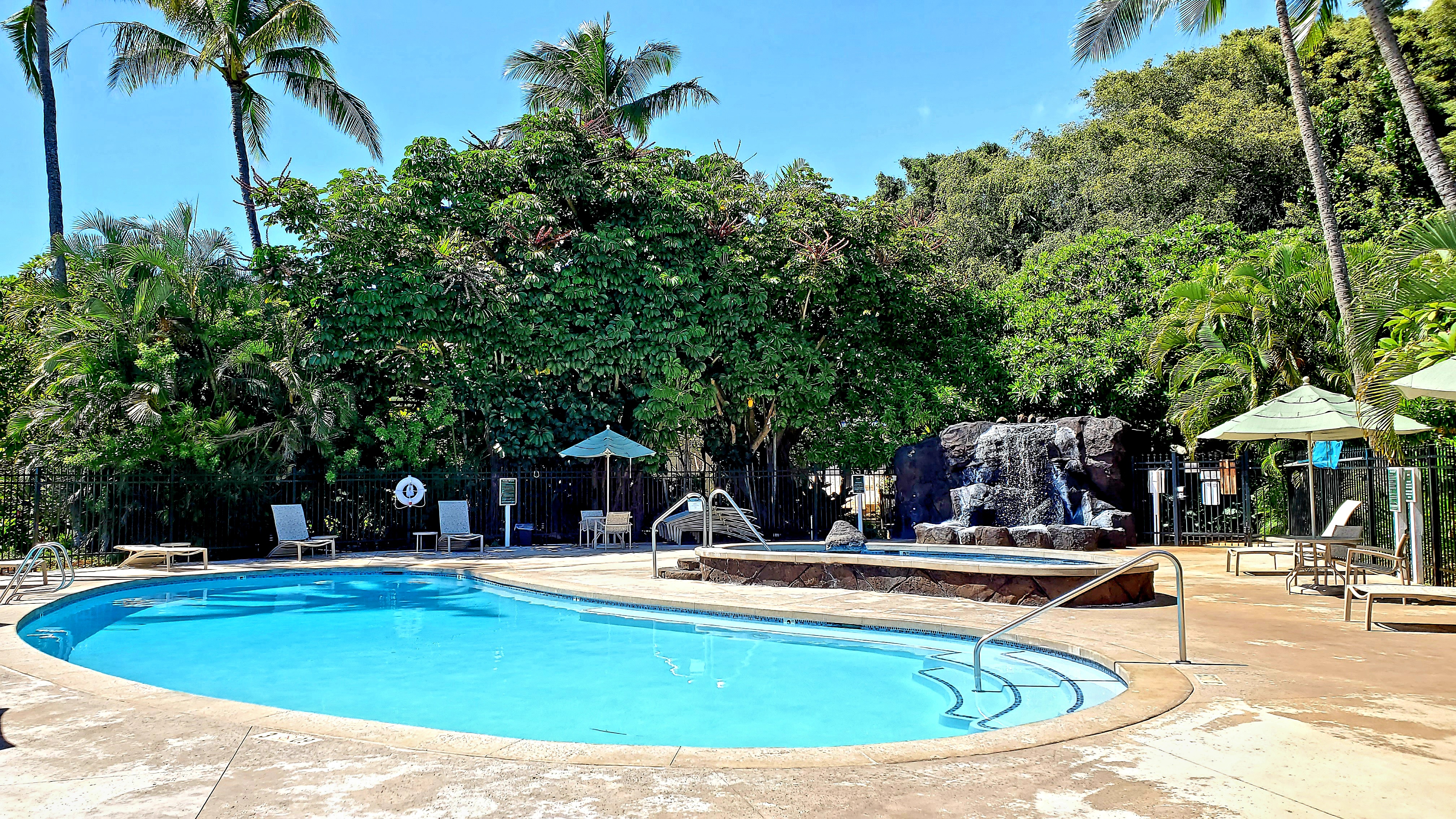 1568 Pe'e Road, Unit 211 Koloa, HI 96756 - Photo 28 of 30 a view of swimming pool with outdoor seating