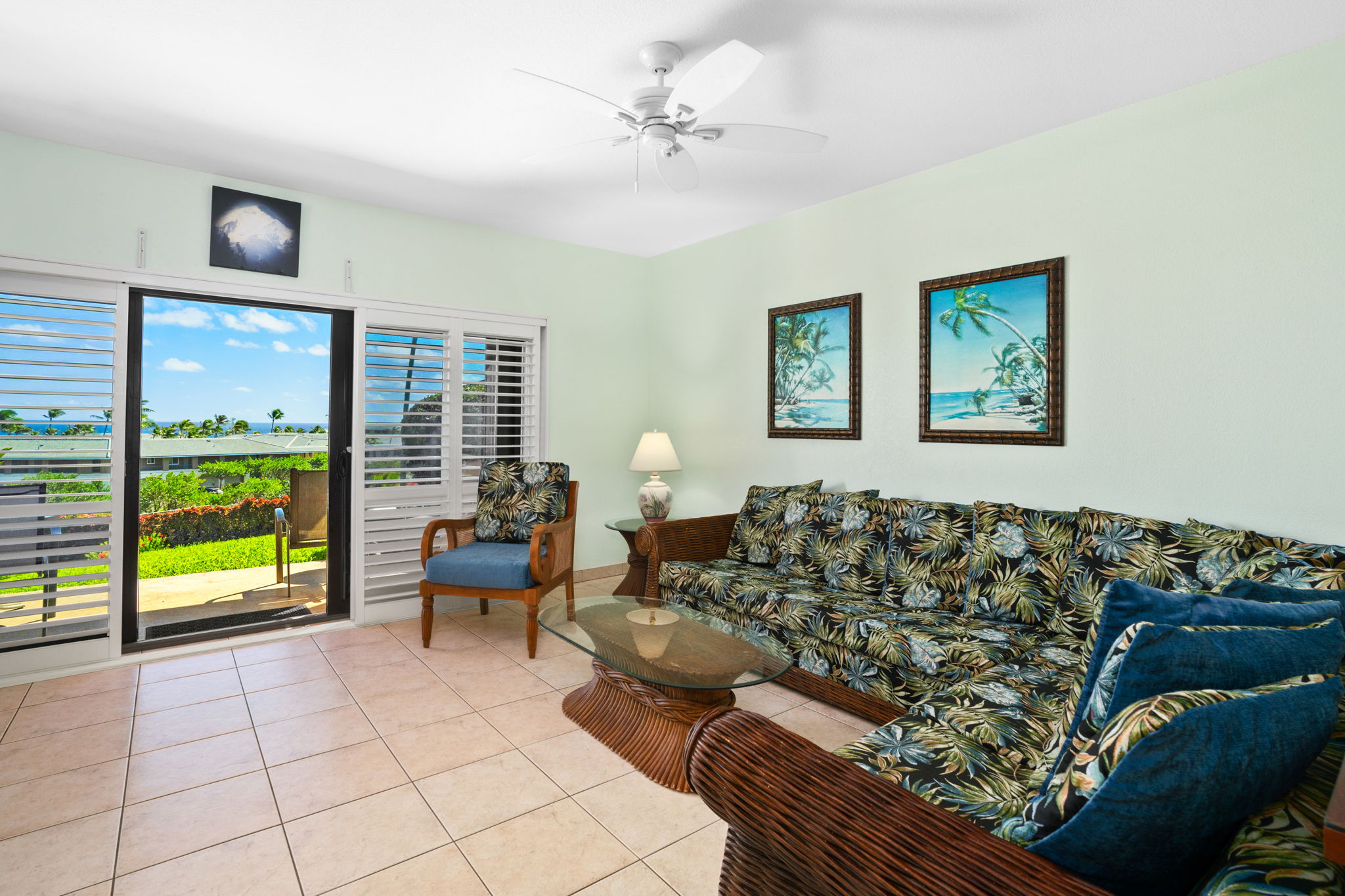 1568 Pe'e Road, Unit 211 Koloa, HI 96756 - Photo 6 of 30 a living room with furniture and a large window