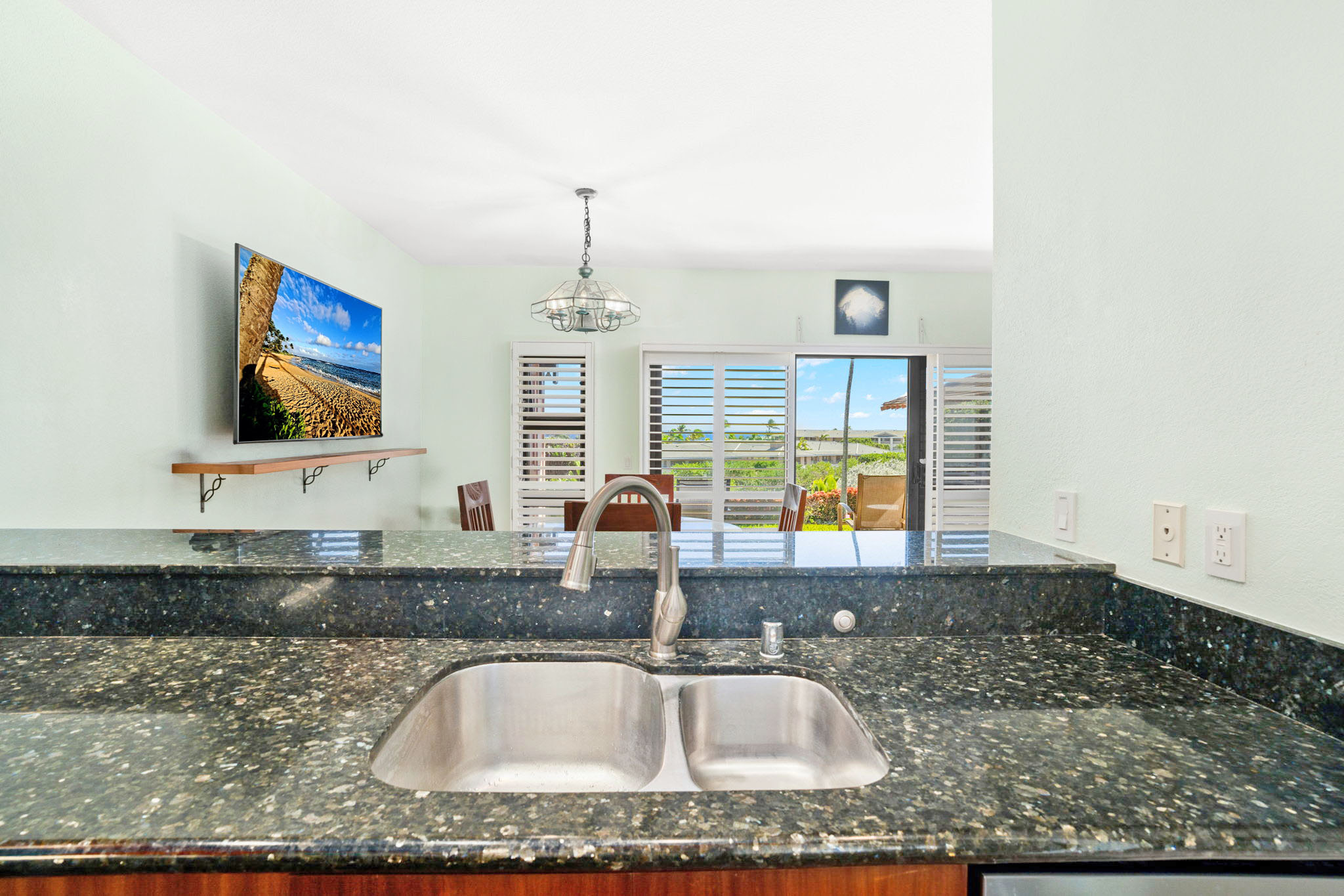 1568 Pe'e Road, Unit 211 Koloa, HI 96756 - Photo 7 of 30 a kitchen with a sink a counter top space and cabinets