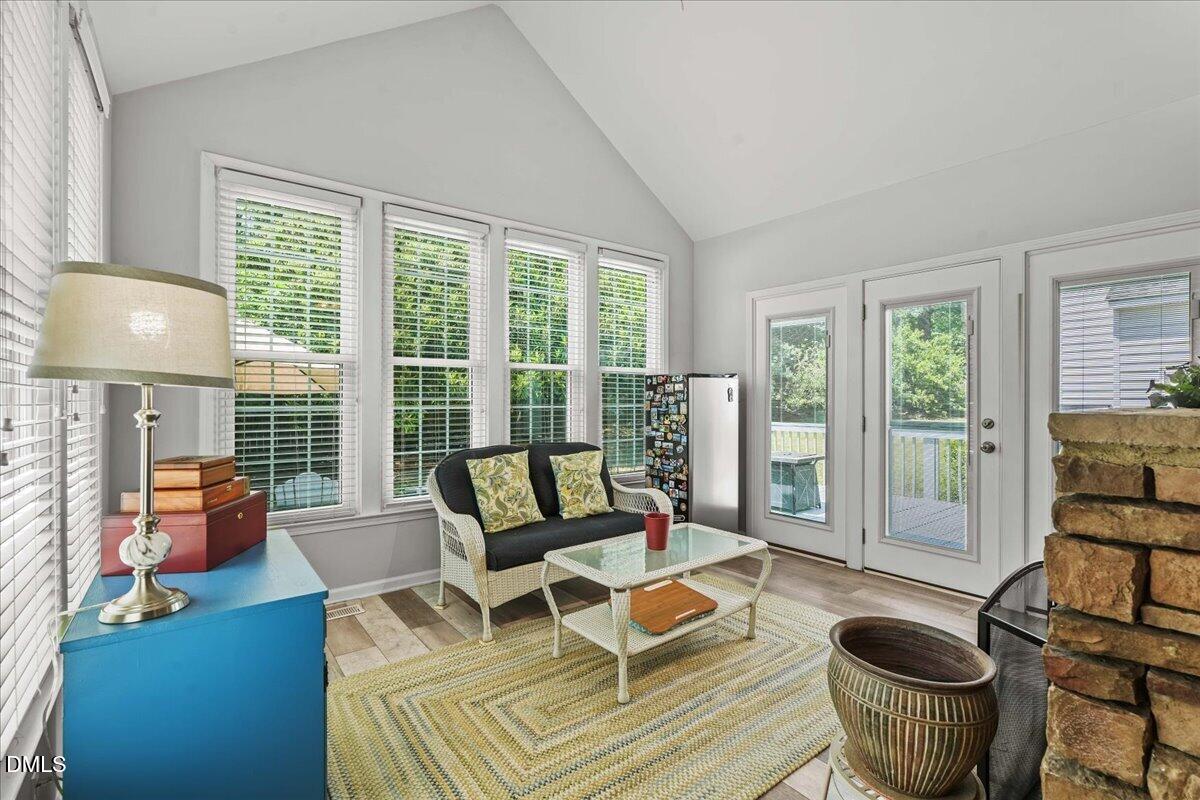 3331 Swinford Court Raleigh, NC 27604 - Photo 11 of 27 a living room with furniture and a potted plant