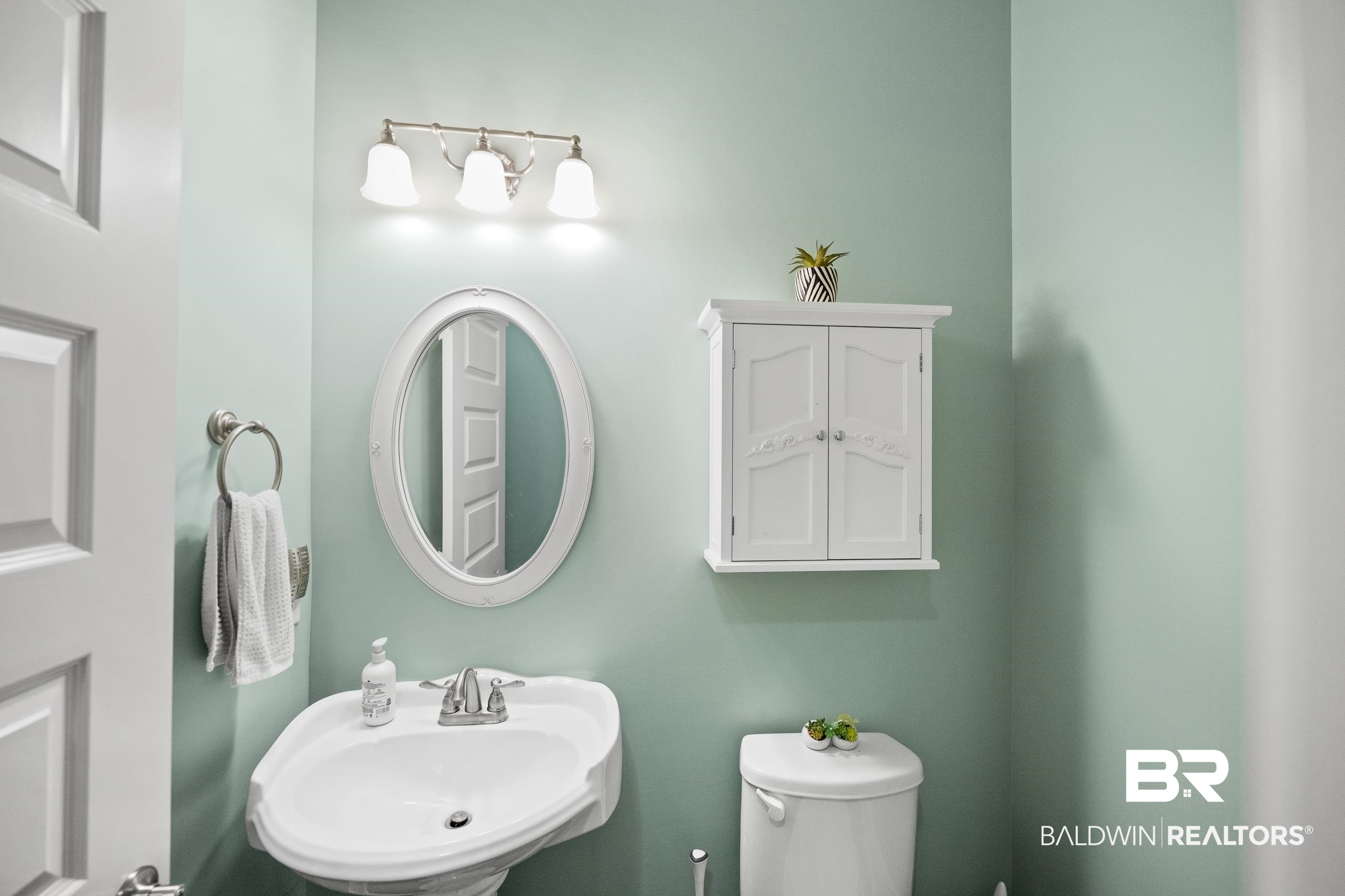 9060 Bromley Road Bay Minette, AL 36507 - Photo 17 of 63 Bathroom featuring a sink and toilet