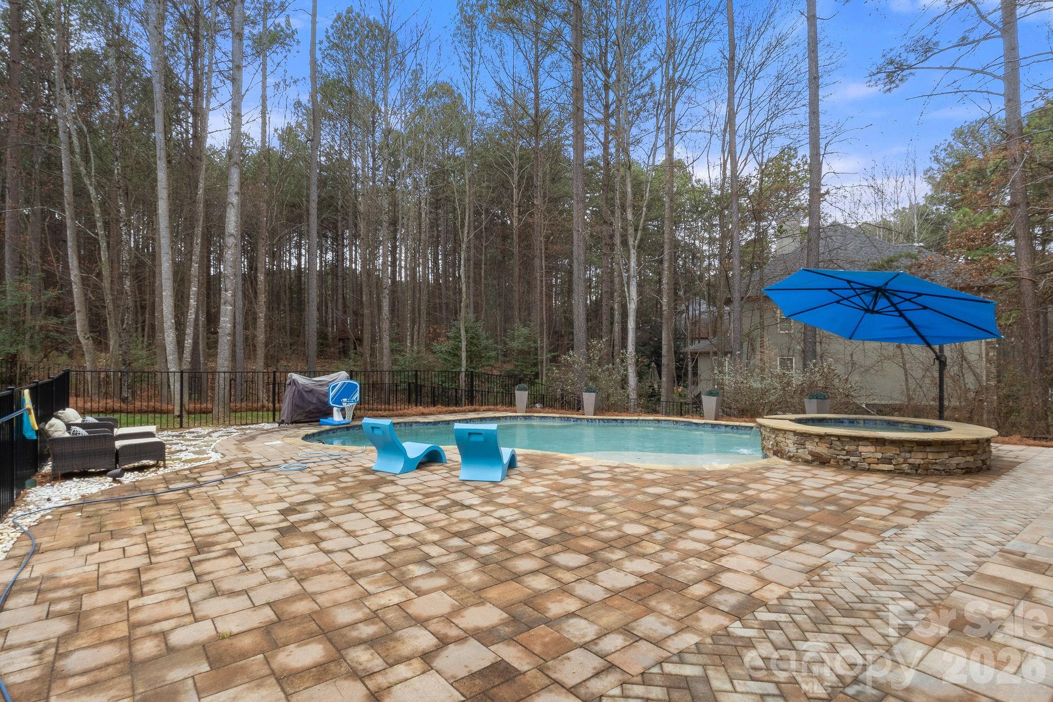 7261 Bay Ridge Drive Denver, NC 28037 - Photo 11 of 48 a backyard of a house with table and chairs