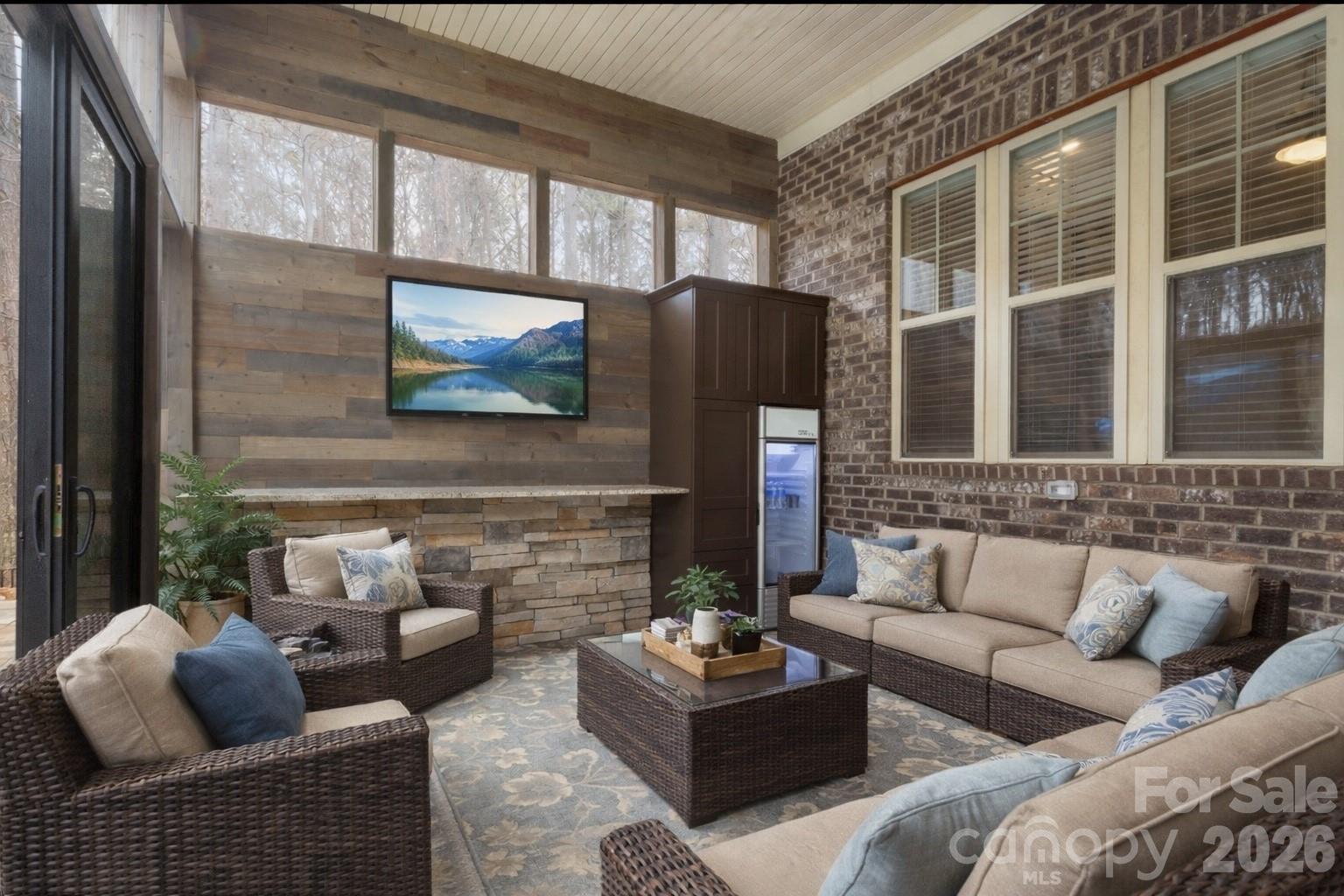 7261 Bay Ridge Drive Denver, NC 28037 - Photo 12 of 48 a living room with furniture and a flat screen tv