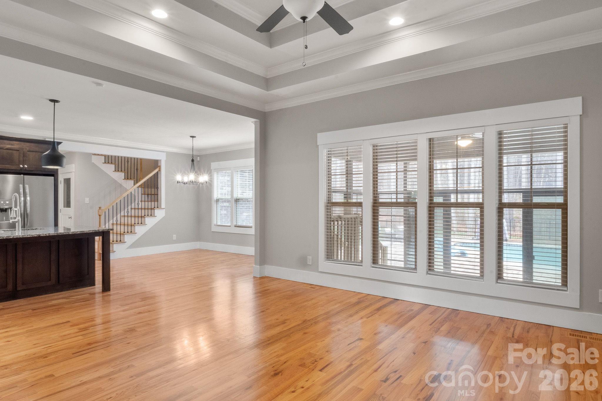 7261 Bay Ridge Drive Denver, NC 28037 - Photo 17 of 48 a view of an empty room with wooden floor and a window
