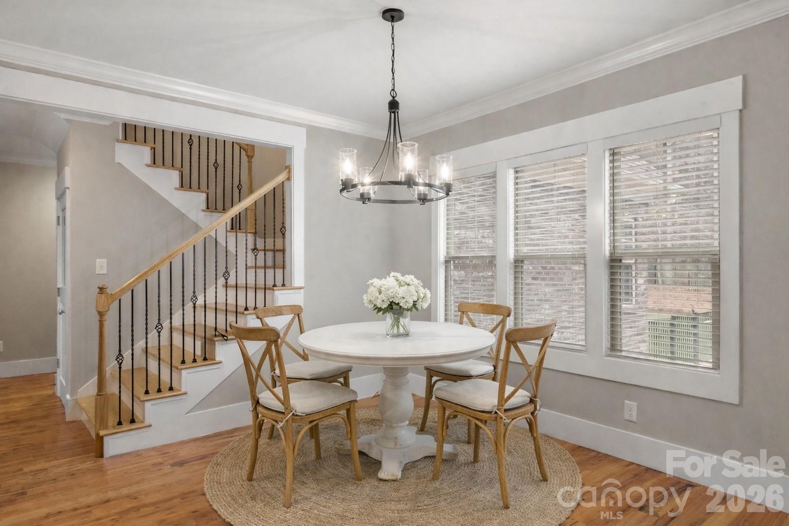 7261 Bay Ridge Drive Denver, NC 28037 - Photo 20 of 48 a dining room with furniture a chandelier and wooden floor
