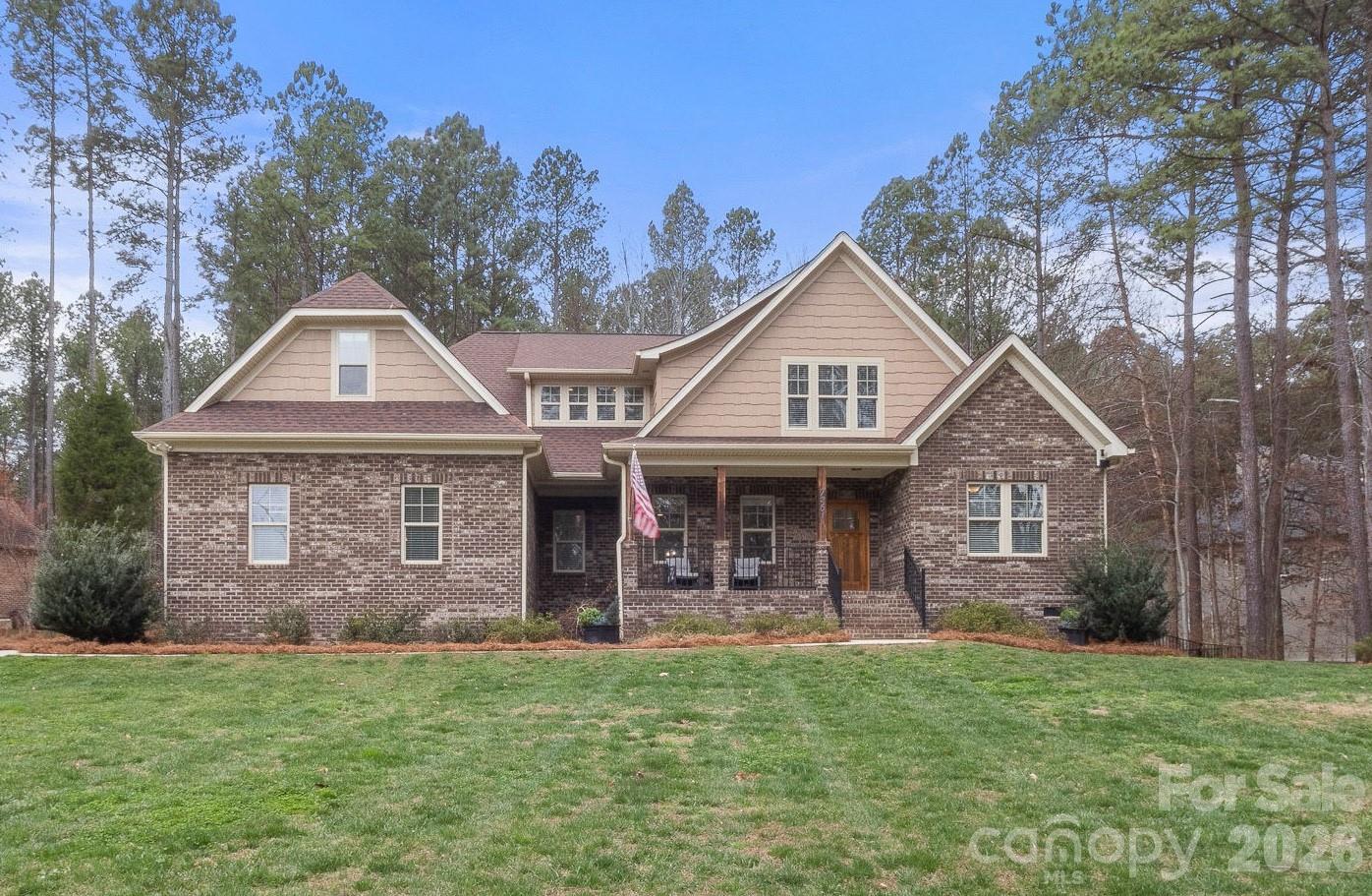 7261 Bay Ridge Drive Denver, NC 28037 - Photo 2 of 48 front view of a house with a yard