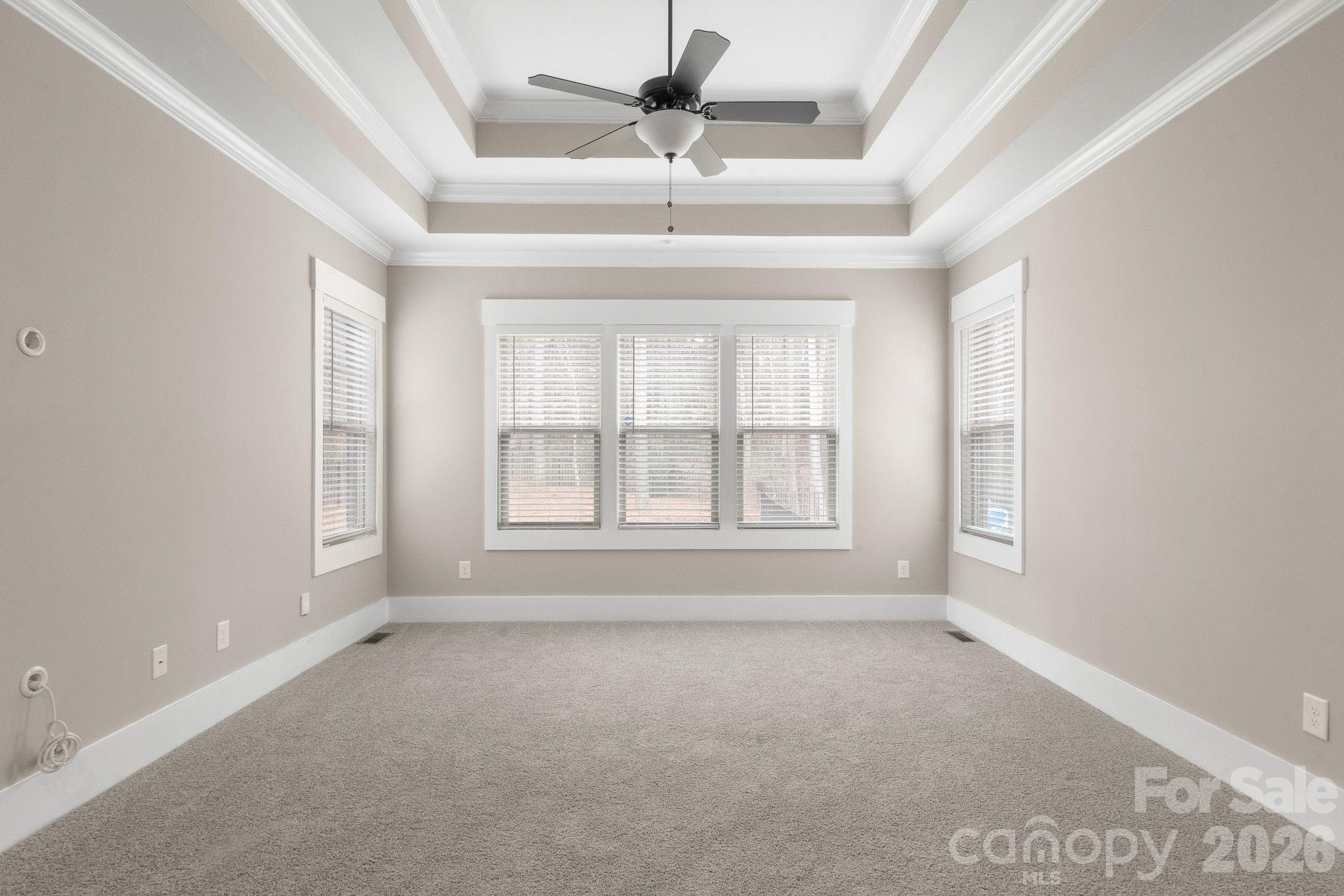 7261 Bay Ridge Drive Denver, NC 28037 - Photo 27 of 48 an empty room with a window and a ceiling fan