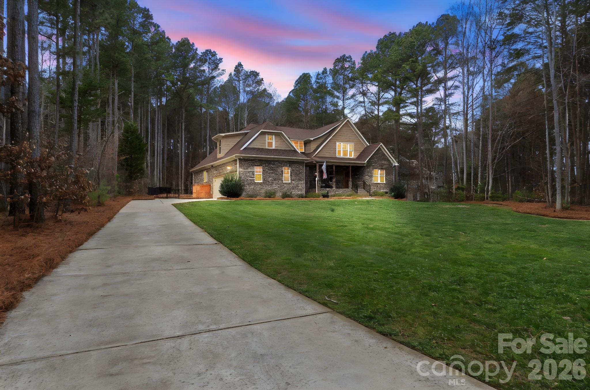 7261 Bay Ridge Drive Denver, NC 28037 - Photo 3 of 48 a front view of a house with yard