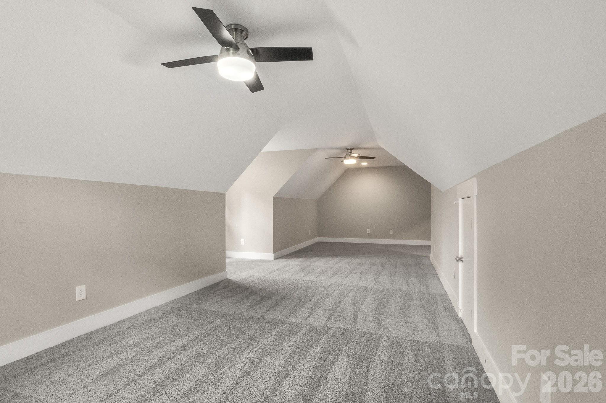 7261 Bay Ridge Drive Denver, NC 28037 - Photo 45 of 48 an empty room with wooden floor fan and windows
