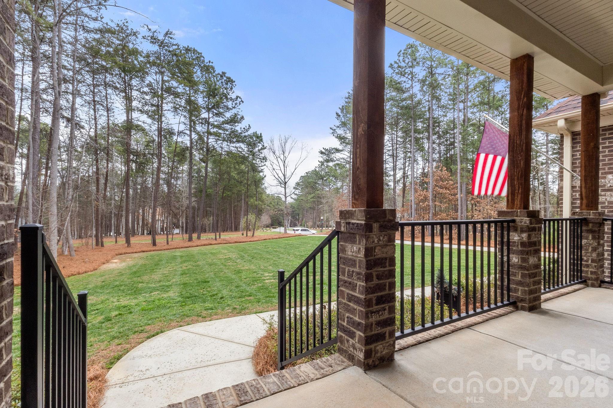 7261 Bay Ridge Drive Denver, NC 28037 - Photo 6 of 48 a view of a porch with a yard