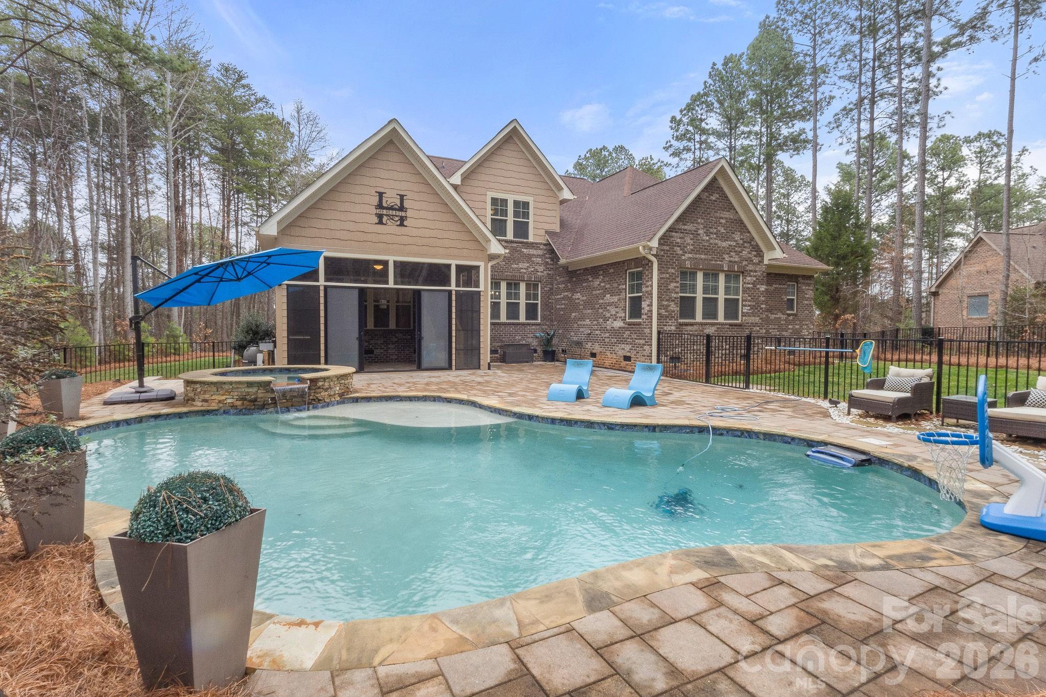 7261 Bay Ridge Drive Denver, NC 28037 - Photo 10 of 48 a front view of a house with swimming pool having outdoor seating