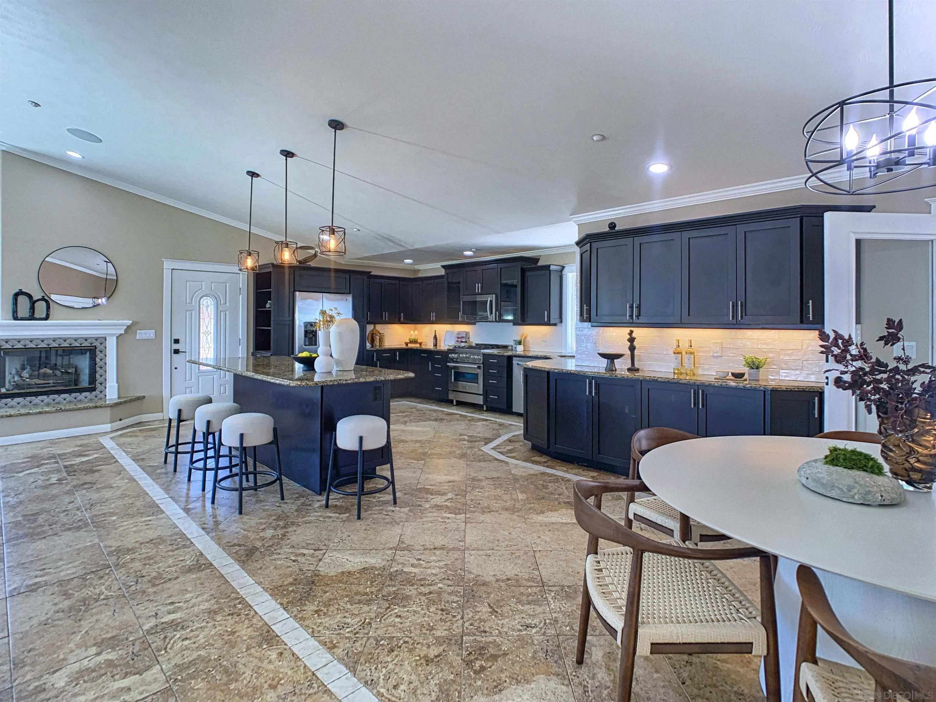 205 Highline Trail El Cajon, CA 92021 - Photo 6 of 45 a kitchen with a dining table chairs stove and kitchen view
