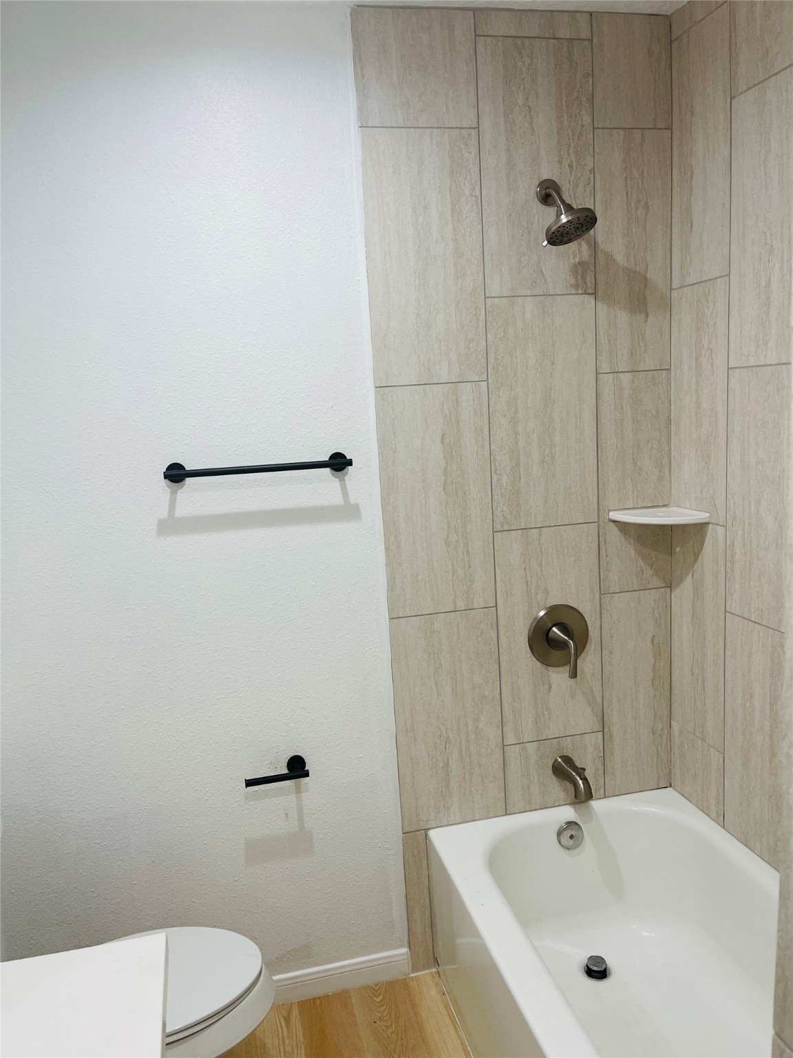 9434 Rhode Island Street Houston, TX 77029 - Photo 13 of 15 a bathroom with a sink a toilet and shower