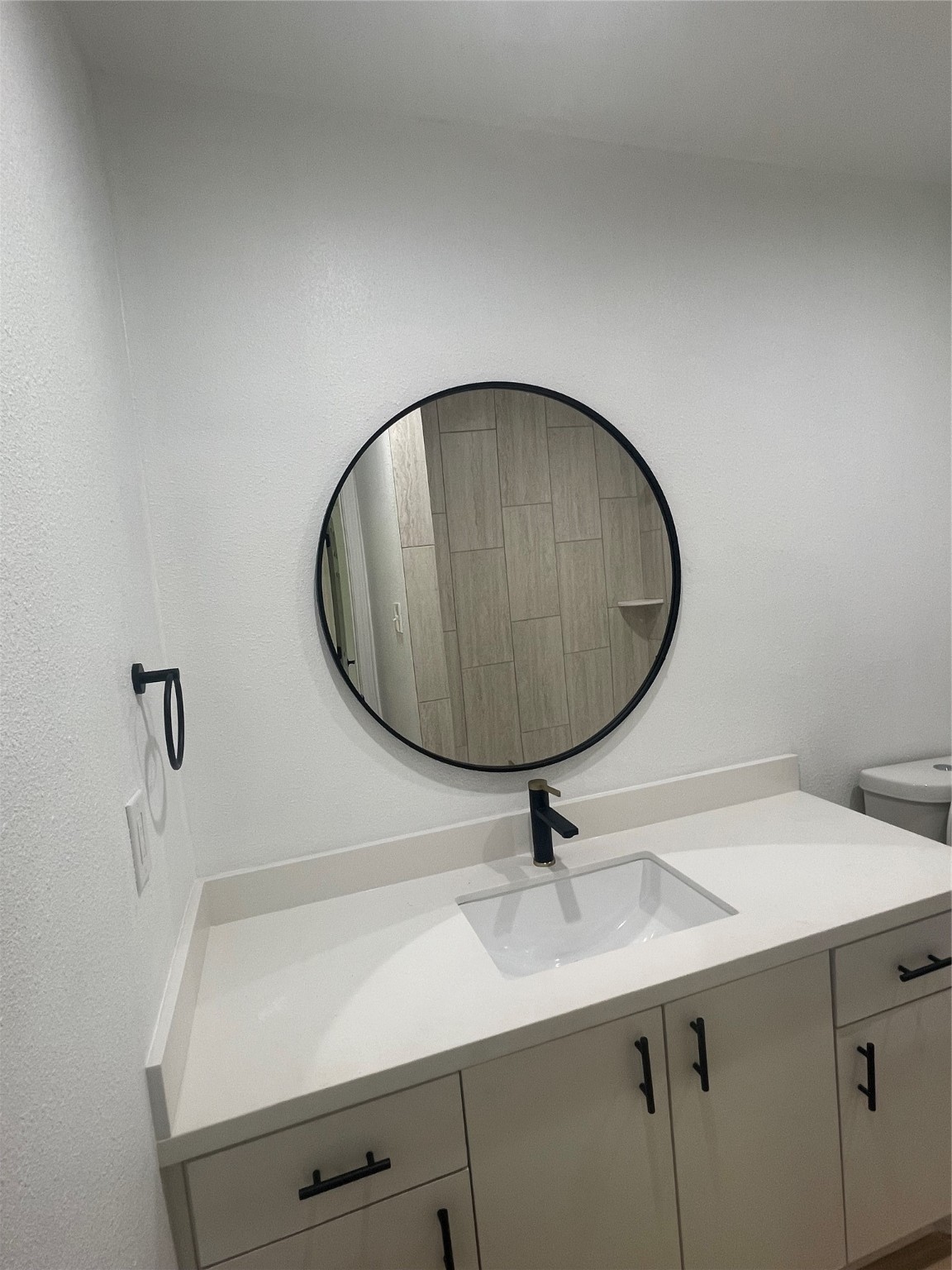 9434 Rhode Island Street Houston, TX 77029 - Photo 10 of 15 a bathroom with a sink and mirror