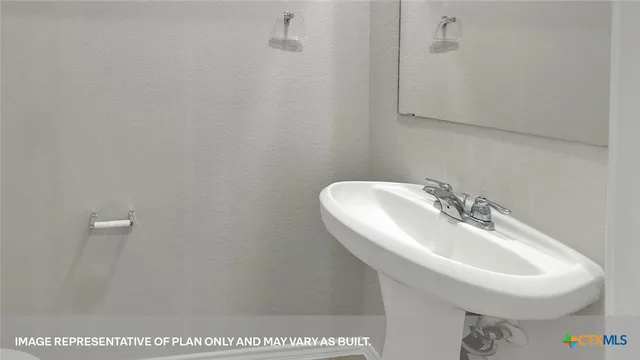 a kitchen that has a sink and a stove