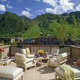 a terrace of a house with outdoor seating