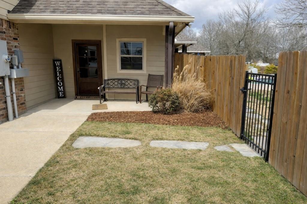 252 Tanner Street Stonewall, LA 71078 - Photo 27 of 34 a view of a house with backyard and sitting area