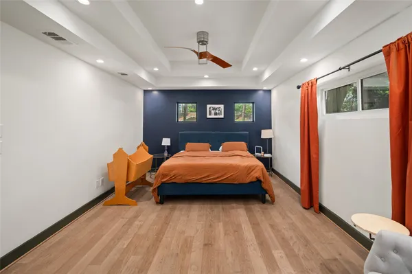a bed room with a bed and a chair