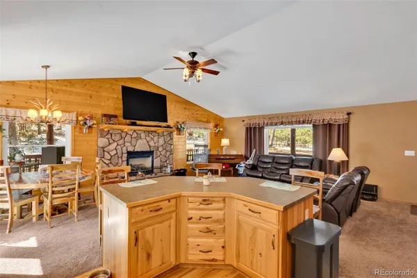 a view of a livingroom with furniture and a flat screen tv