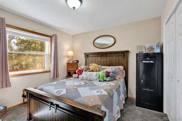 a bed room with a bed and a window