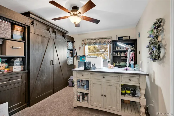 a view of a kitchen with fridge and wooden floor