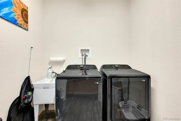 a kitchen with a stove and a refrigerator