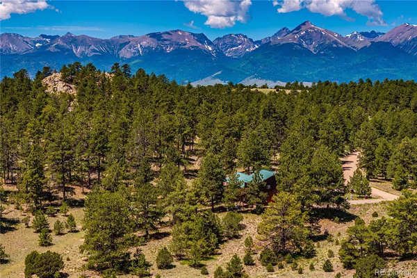 an aerial view of houses with yard