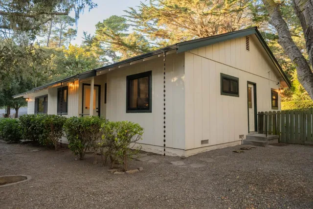 a house with trees in front of it