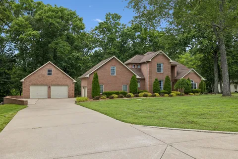 a front of a house with a yard