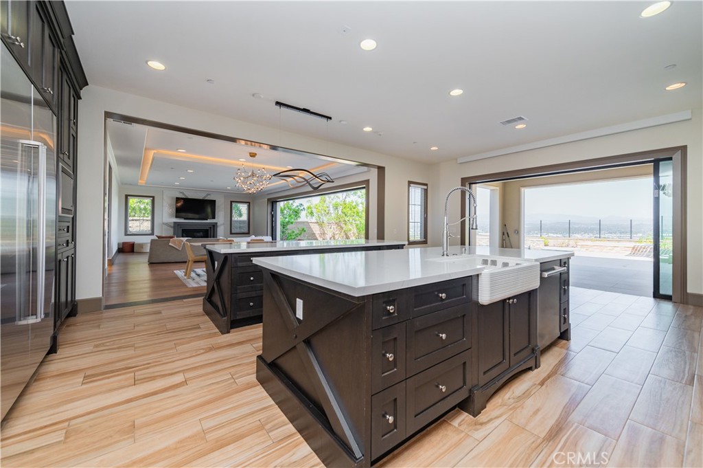122 Scenic Crest Irvine, CA 92618 - Photo 13 of 68 a kitchen with wooden cabinets and center island