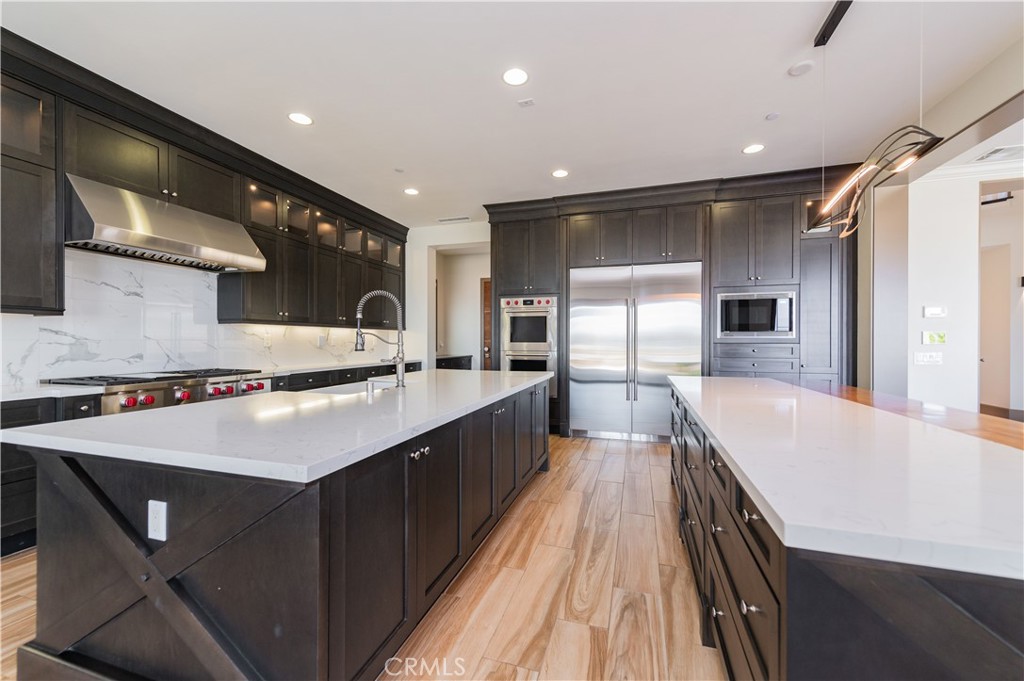 122 Scenic Crest Irvine, CA 92618 - Photo 17 of 68 a large kitchen with stainless steel appliances a large counter top
