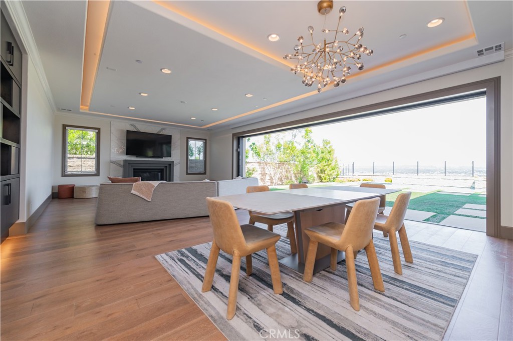 122 Scenic Crest Irvine, CA 92618 - Photo 20 of 68 a view of a dining room with furniture window and wooden floor