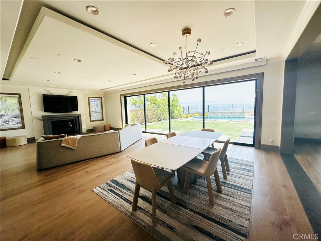 122 Scenic Crest Irvine, CA 92618 - Photo 23 of 68 a view of a dining room with furniture window and wooden floor