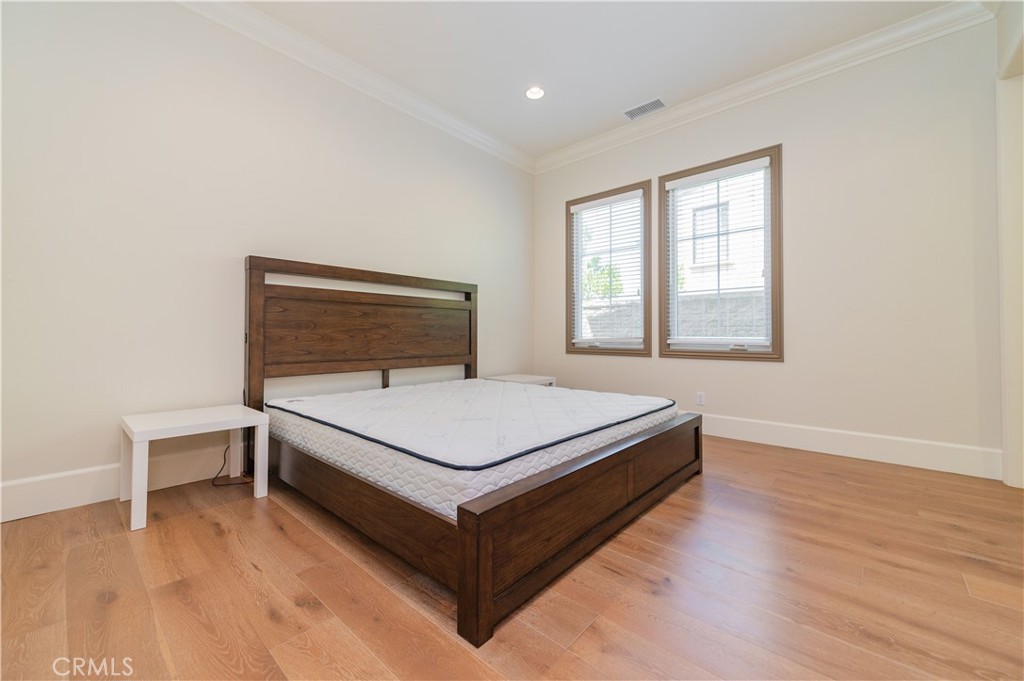 122 Scenic Crest Irvine, CA 92618 - Photo 29 of 68 a living room with a bed furniture and a window