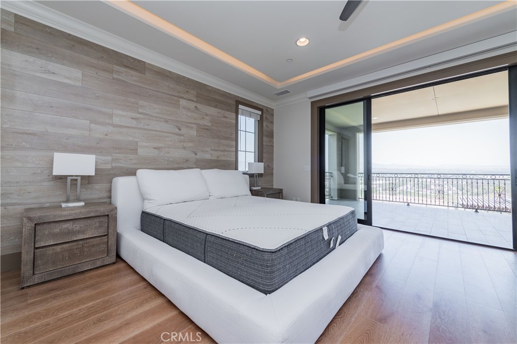 122 Scenic Crest Irvine, CA 92618 - Photo 33 of 68 a spacious bedroom with a bed and large window