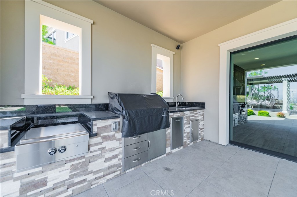 122 Scenic Crest Irvine, CA 92618 - Photo 49 of 68 a kitchen that has a sink and a stove in it