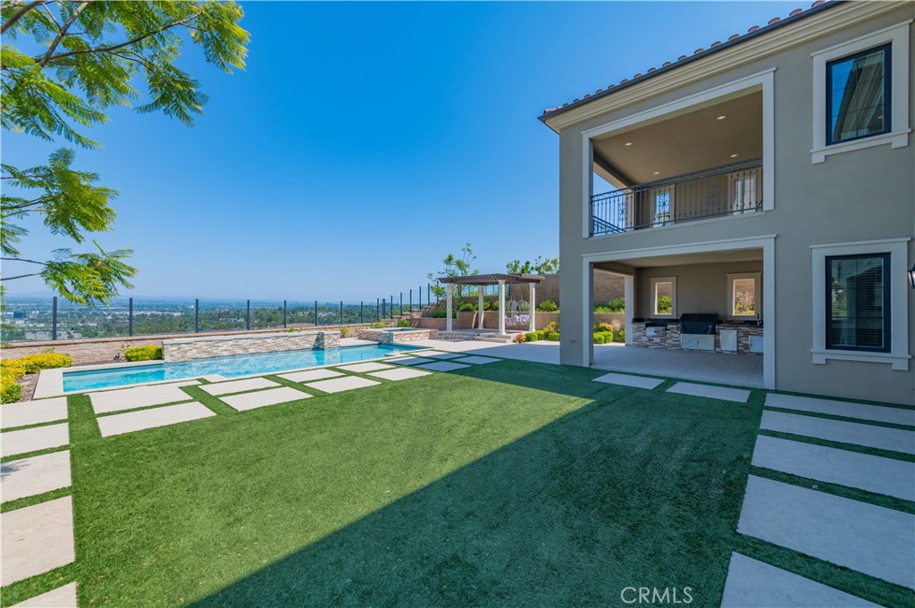 122 Scenic Crest Irvine, CA 92618 - Photo 53 of 68 a swimming pool with outdoor seating and yard