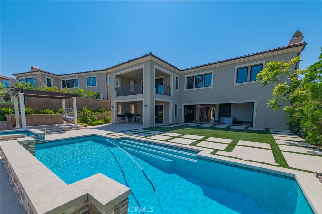 122 Scenic Crest Irvine, CA 92618 - Photo 54 of 68 a view of an house with swimming pool and porch