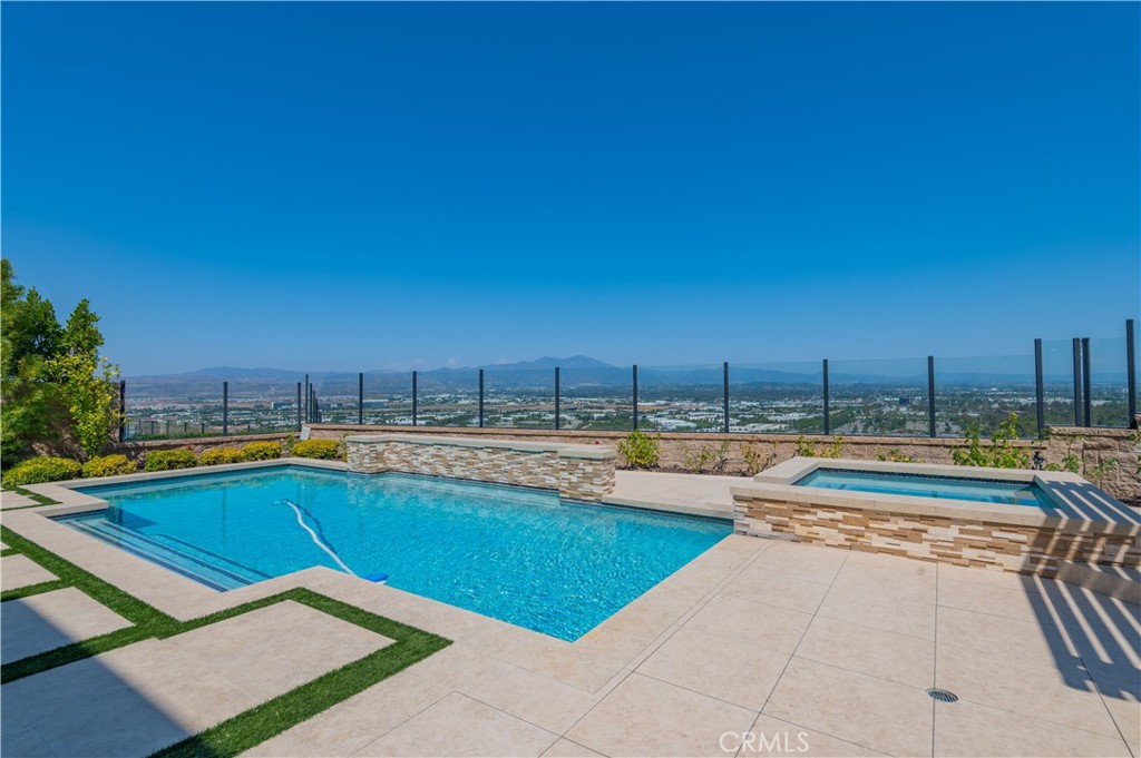 122 Scenic Crest Irvine, CA 92618 - Photo 56 of 68 a view of a swimming pool and a lounge chairs