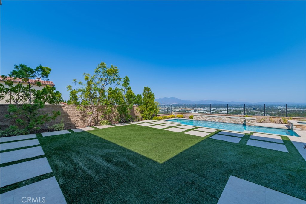 122 Scenic Crest Irvine, CA 92618 - Photo 57 of 68 a view of a swimming pool with a yard
